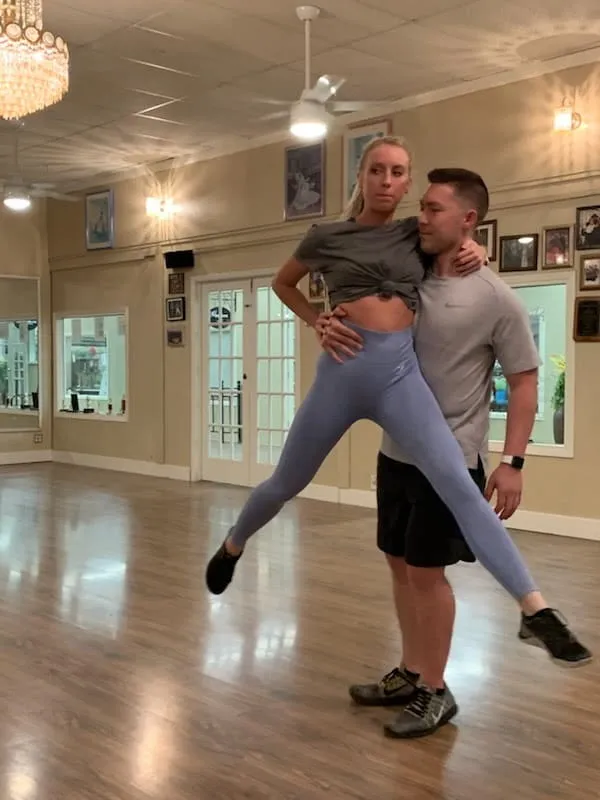 An overhead lift being practised in the studio